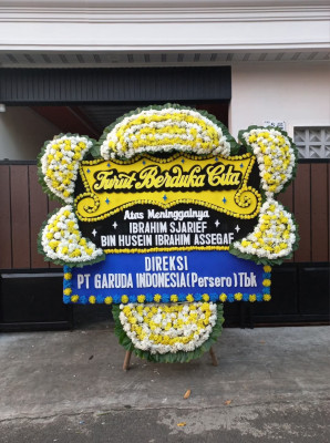 Papan Bunga Duka di Seberang